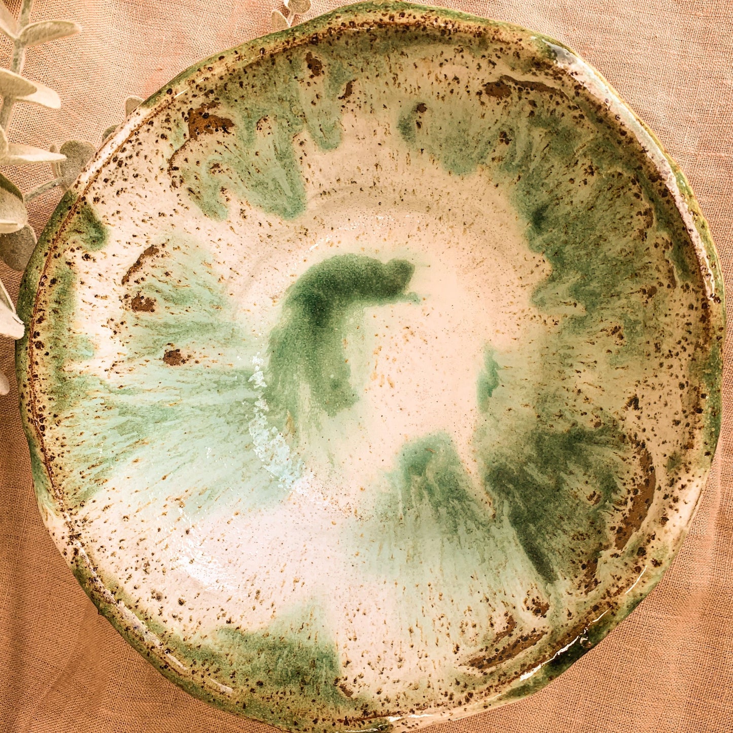 Handmade salad bowl, green, rustic, overhead shot