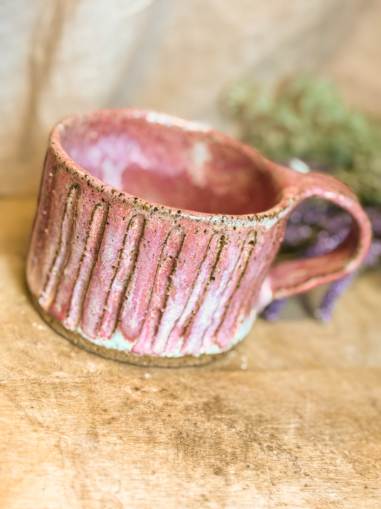 pink handmade mug with detail engraving