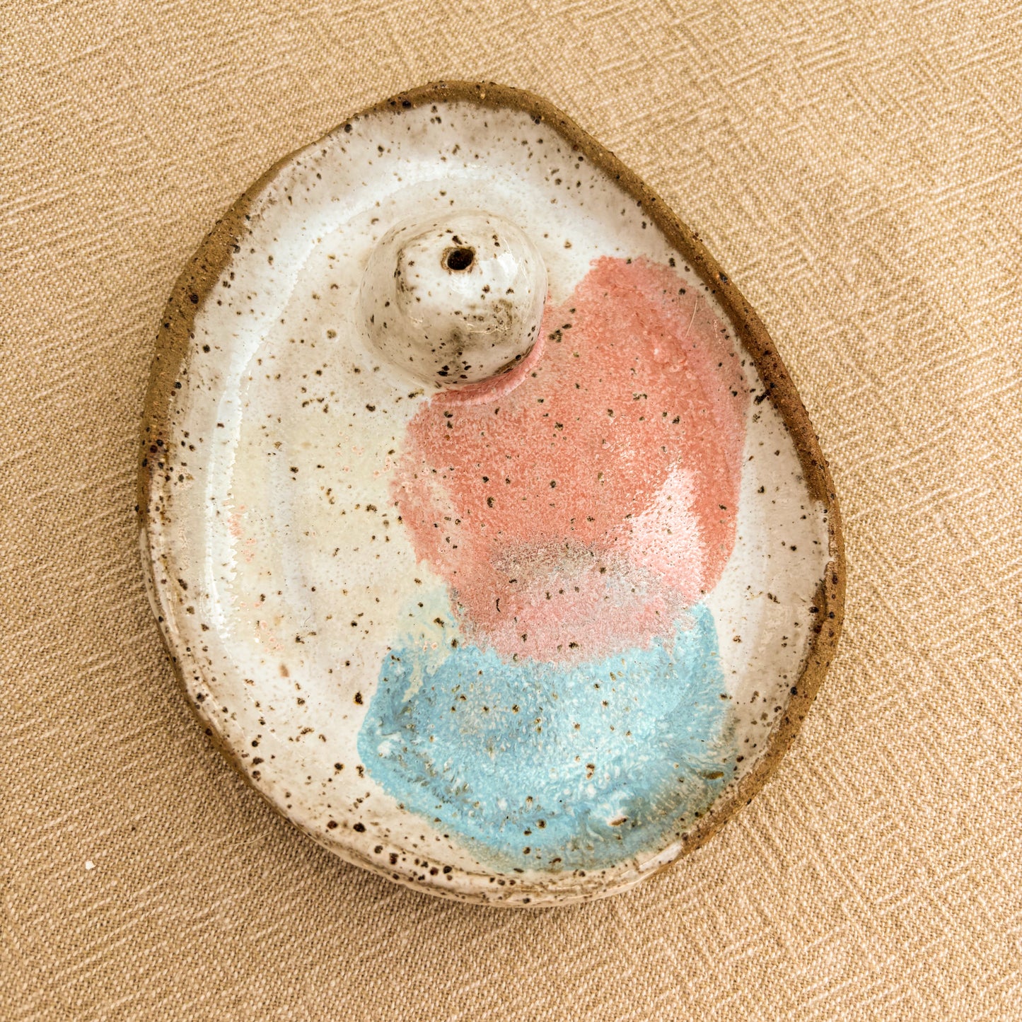 handmade incense holder, pink, blue, overhead shot