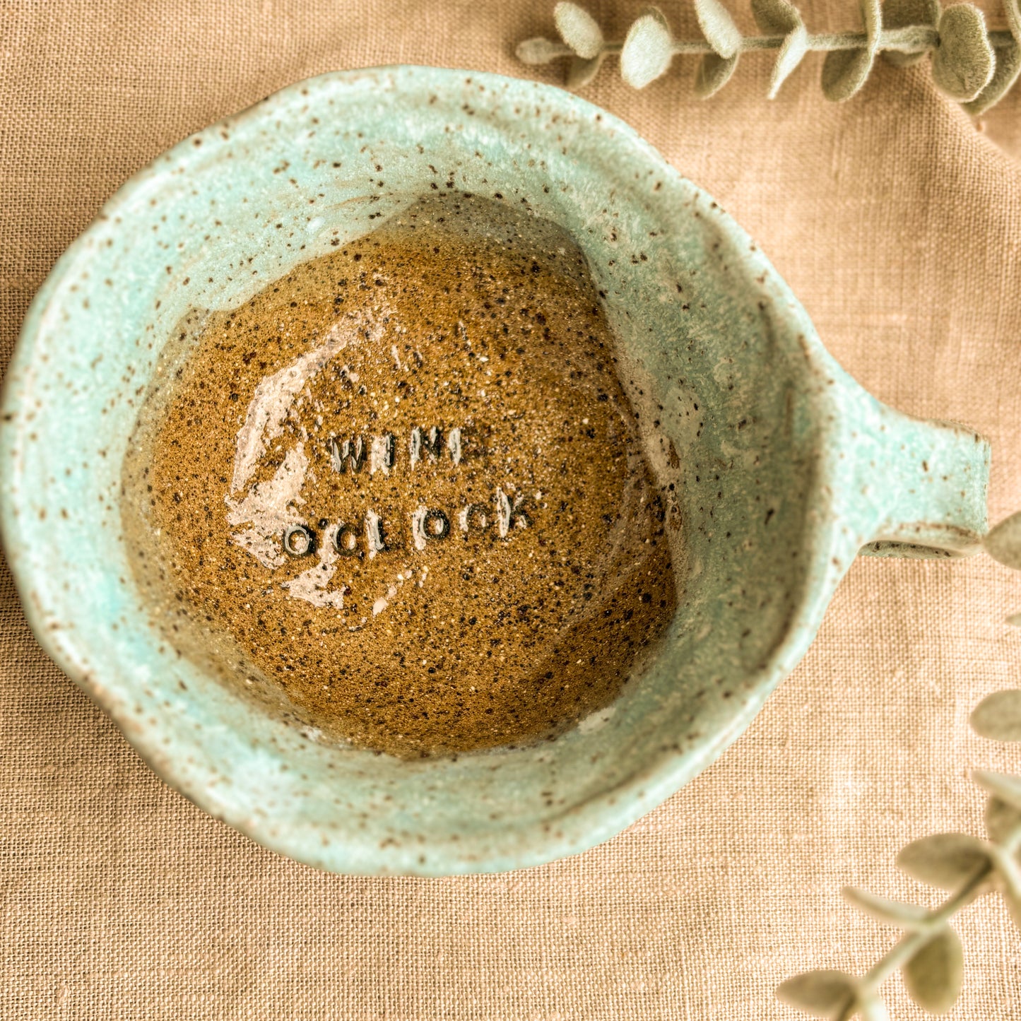 Handmade pinch mug, blue, wine oclock, overhead  shot